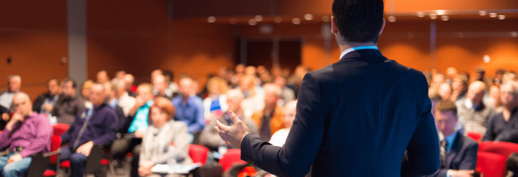 A speaker at a conference for CPAs