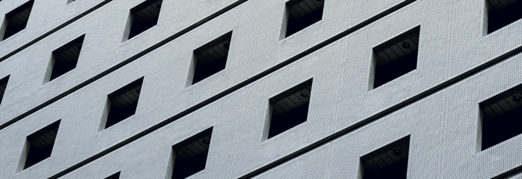 A concrete, block building representing the way lifelong learning helps construct knowledge piece by piece